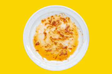 Dirty dish on yellow background. Top view