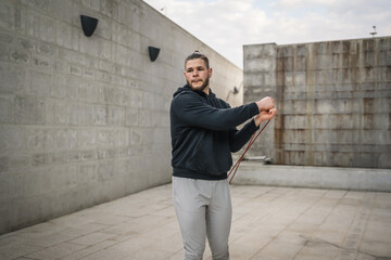 One man jump rope outdoor training young male exercise in the city