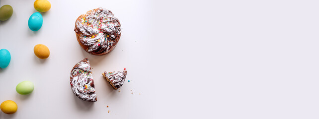 Banner of Easter Kraffin on light background with colored eggs. Cake with raisins, chocolate, nuts,
