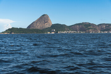 Guanabara Bay in Rio de Janeiro, Brazil with Sugarloaf Mountain in the background. Beautiful landscape and hill with the sea. Sunny summer day