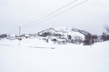 Fototapeta na wymiar snowy landscape view in tromso fjords, norway