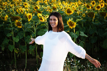 beautiful carefree woman in the fields being happy outdoors