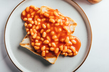 Baked Beans in Tomato Sauce on Slice of Toasted Bread, traditional British breakfast