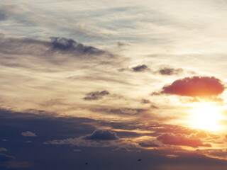 Dark dramatic sunset sky with white clouds. Background for design purpose and sky replacement.