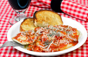 Ravioli dinner with a side of garlic bread.