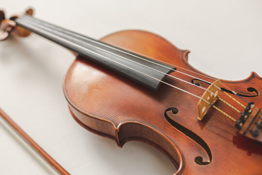 Beautiful Violin Closeup on White Background, Classical, Bluegrass, or Celtic Instrument with Detail