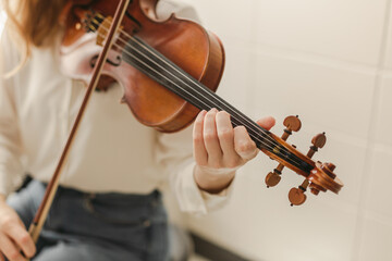 Young Woman Playing Classical Instrument Violin or Bluegrass Fiddle