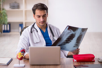 Young male doctor radiologist working in the clinic