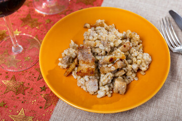 Delicious serving of barley porridge with lard served beautifully