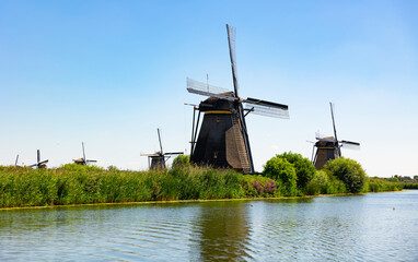 Windmills along waterside in Kinderdijk, South Holland, municipality of Molenlanden, Netherlands.