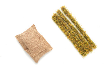 A picture of miniature rice paddy field and rice bags on white background