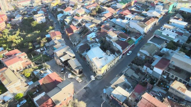 Flight over Plaza Santa Margarita on Cerro Larra&iacute;n and vertical panning over the bay of Valpara&iacute;so, Cerro Bar&oacute;n, coastline, sunny summer morning.
