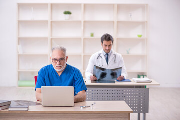 Two male doctors radiologists working in the clinic