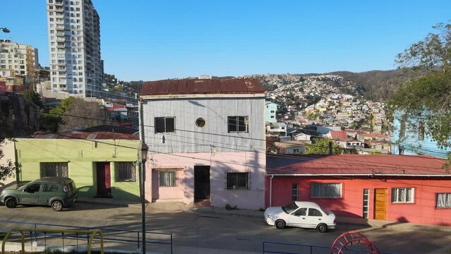 Takeoff from Plaza Santa Margarita, in Cerro Larra&iacute;n towards the south of Valparaiso, look over Cerro Polanco and housing complexes, sunny summer morning
