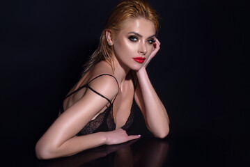 Fototapeta premium Beauty face of younf woman with natural healthy skin. Beautiful female portrait. Young woman with clean fresh skin on studio background. Face care, facial treatment, cosmetology, beauty and spa.