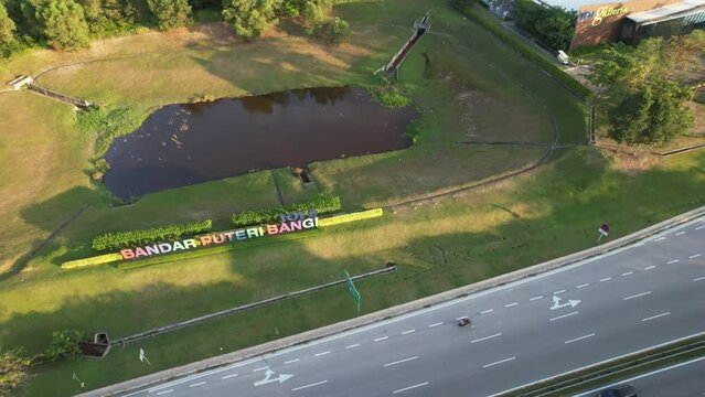 Selangor, Malaysia - March 28, 2023 Aerial pan to the right near the Bandar Puteri Bangi and IOI galleria during sunset.