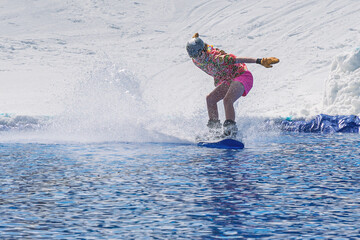People are enjoying Pond skim at the end of ski season