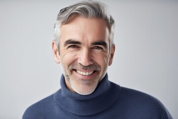 Confident 40-year-old man in blue sweater smiling on white background. Generative AI - obrazy, fototapety, plakaty