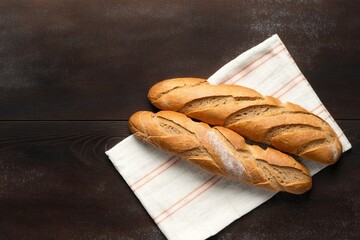loaf of bread on wooden table, two freshly baked loaves, freshly baked bread on a wooden table