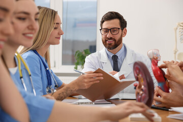 Doctor giving lecture for interns in university