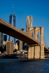 Brooklyn, NY - USA - March 26, 2023 Sunrise view of lower Manhattan, featuring the Brooklyn Bridge,...