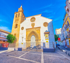 The facade of medieval church in old Seville, Spain