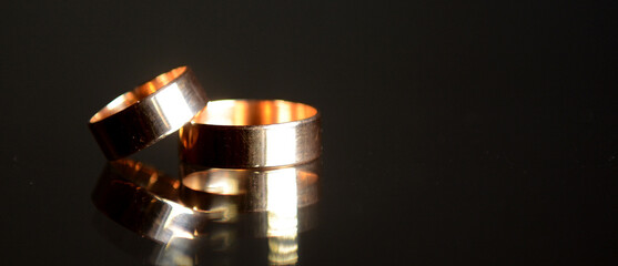 wedding gold rings on a black background. High quality photo