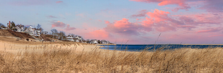 Sunset sky over Chatham Lighthouse Beach in winter
