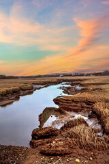 Sunset sky over the marsh and Sesuit Creek in East Dennis in winter