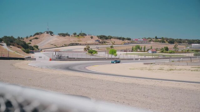 Car going around a corner at a track