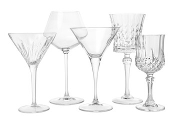 Different elegant empty glasses isolated on white