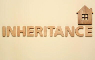 Word Inheritance made with wooden letters and house model on beige background, flat lay