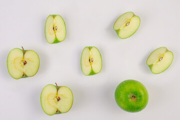 Fresh green apple fruit with cut in half and slice isolated on white background.