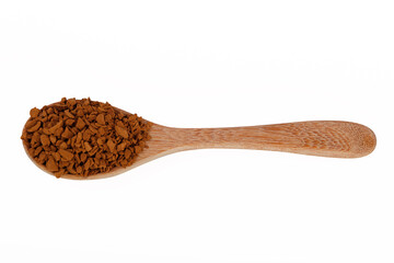 Top view of Instant coffee on wooden spoon isolated on white background. Instant coffee is a beverage derived from brewed coffee beans that enables people to quickly prepare hot coffee.