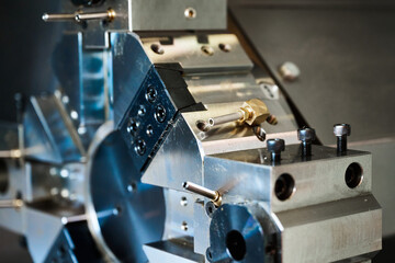 Fototapeta na wymiar Lathe machine tool with shiny turret in production plant