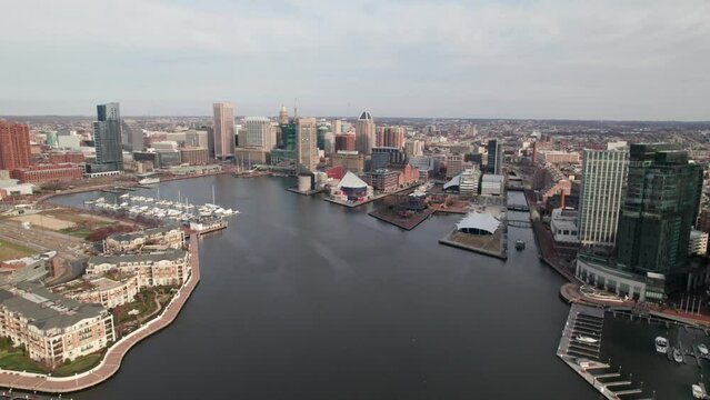 Side-moving drone shot, Baltimore Inner Harbor, rich colors of the downtown cityscape. 4K