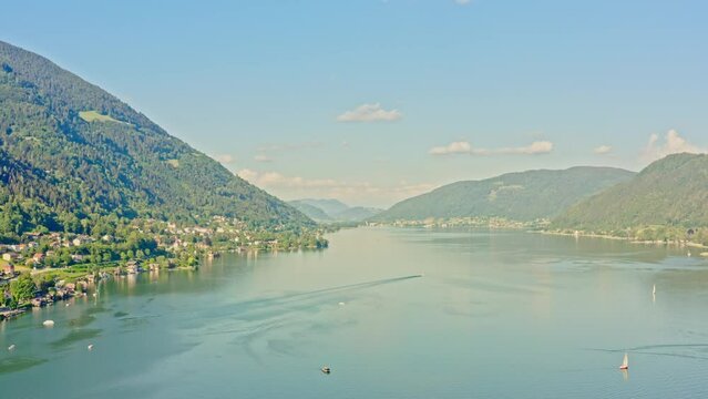 Lake Ossiach is a stunning alpine lake located in the state of Carinthia, Austria, surrounded by the majestic Nock Mountains and offering a range of recreational activities. Aerial view