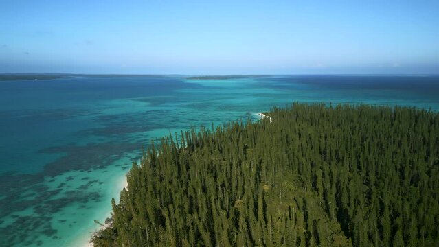 Aerial view above New Caledonia island Ilot Brosse, looking out to Pacific Ocean.