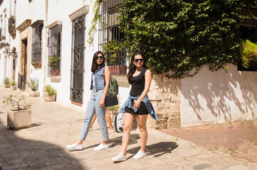 Friends strolling through the old town, Tourist trip on vacation, Travel concept
