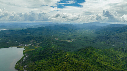 Aerial drone of coast of the island of Borneo with palm oil plantations and jungle. Malaysia.