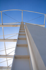 Detail of the structure of a steel structure against the blue sky.