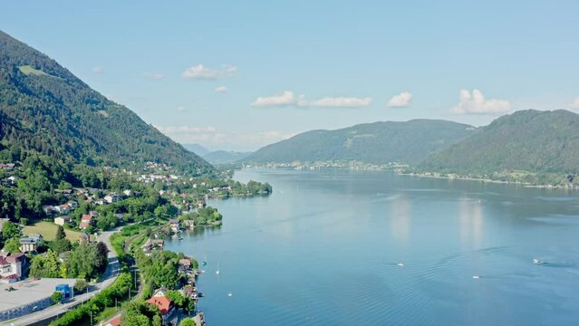 Lake Ossiach is a stunning alpine lake located in the state of Carinthia, Austria, surrounded by the majestic Nock Mountains and offering a range of recreational activities. Aerial view