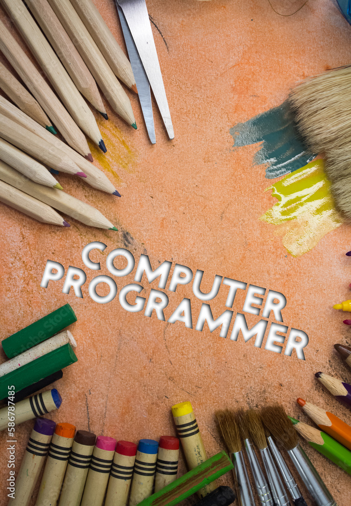 Poster overhead shot of school supplies with computer programmer text. brushes, pencils, artistic tools. ar