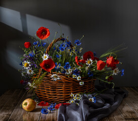 Still life with red poppies and wildflowers