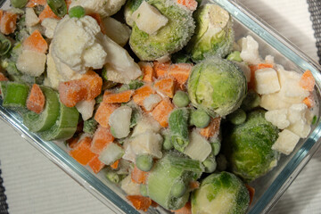 Frozen mixed vegetables for long-term storage. Deep freezing of vegetables. defrosting Frozen food vegetables background