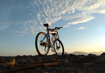 Fototapeta na wymiar Cycling to the beach in the morning at sunrise