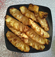 Baked pineapple smothered in honey.