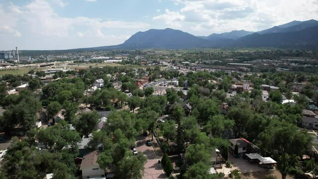 Downtown Suburb of Colorado Springs, Colorado, with Cheyenne Mountain in the background. Aerial 4K drone video