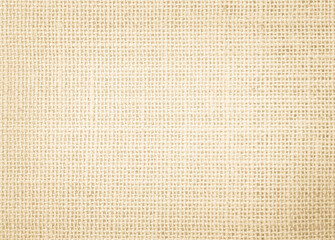 Jute hessian sackcloth burlap canvas woven texture background pattern in light beige cream brown color design element.
