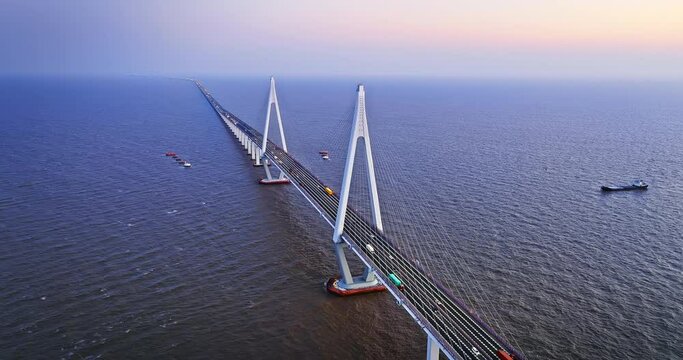 Aerial view of Hangzhou Bay Bridge scenery at sunset, Zhejiang Province, China. The total length of the bridge is 36 kilometers. The design speed is 100 kilometers per hour.